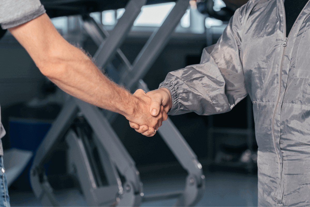 Mechanics shaking hands